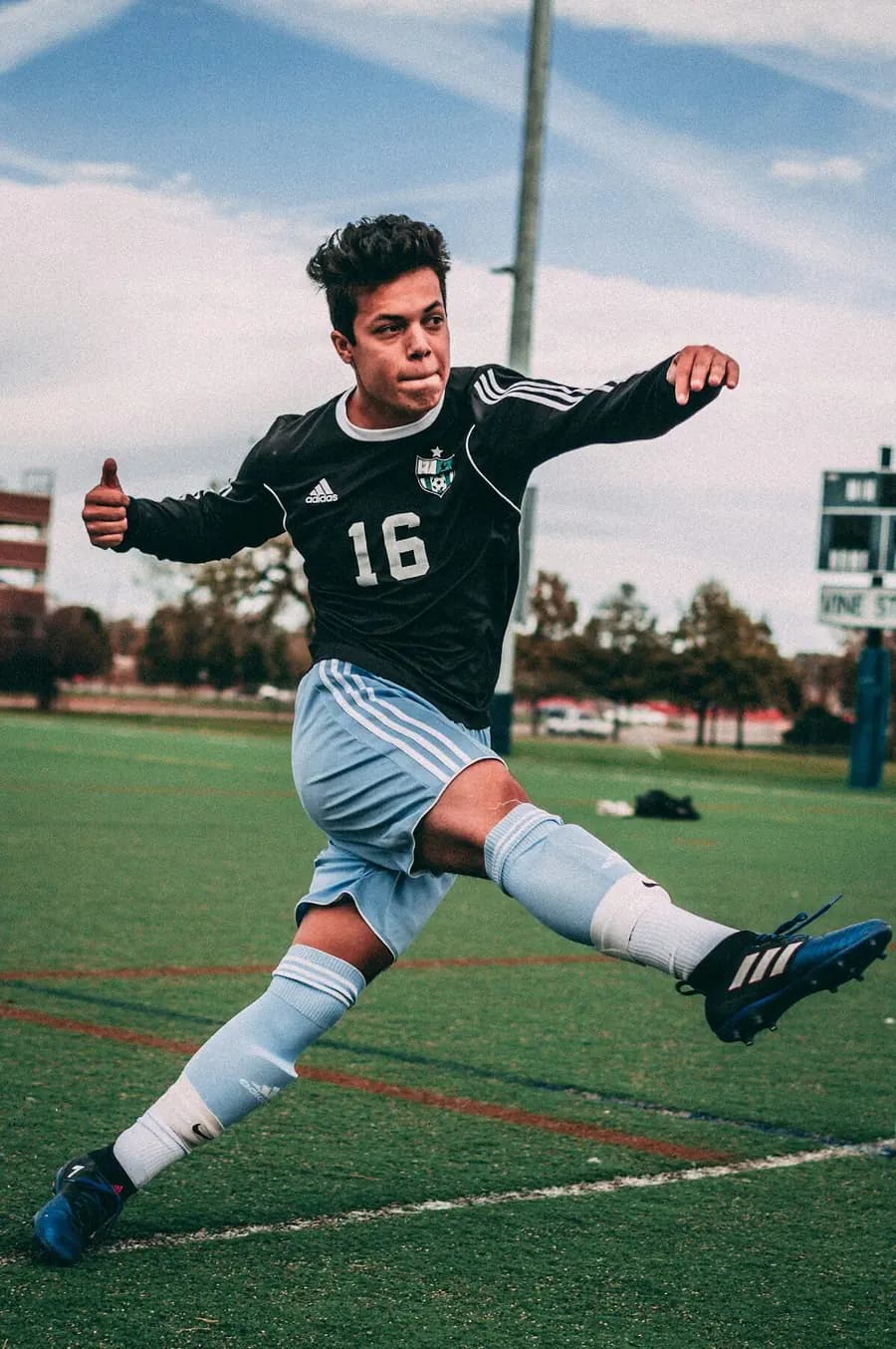 Coach training youth soccer players